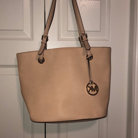 cream colored michael kors purse